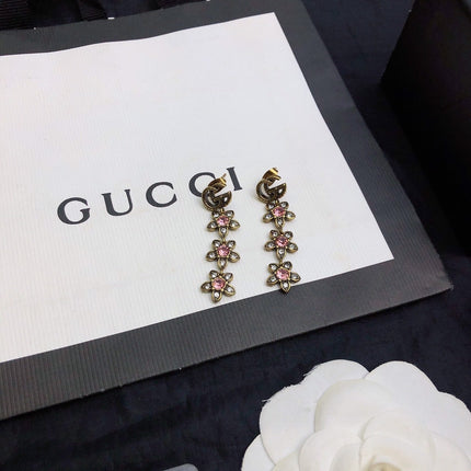 GUCCI 26S DOUBLE G LOGO PINK CRYSTAL FLORAL DROP EARRINGS IN AGED GOLD TONE METAL 629030