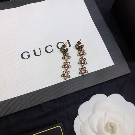 GUCCI 26S DOUBLE G LOGO PINK CRYSTAL FLORAL DROP EARRINGS IN AGED GOLD TONE METAL 629030