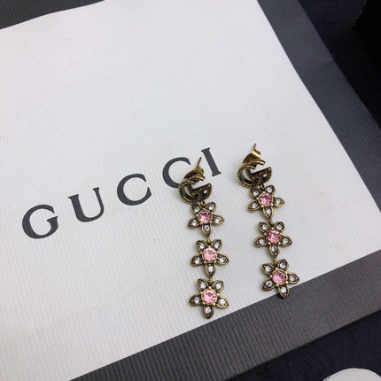 GUCCI 26S DOUBLE G LOGO PINK CRYSTAL FLORAL DROP EARRINGS IN AGED GOLD TONE METAL 629030