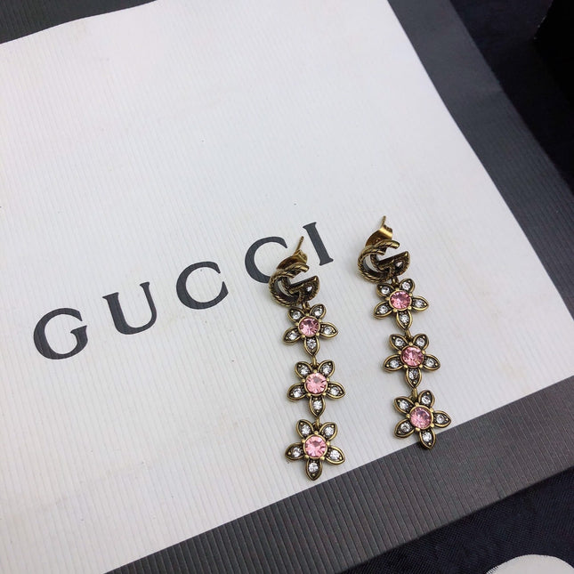 GUCCI 26S DOUBLE G LOGO PINK CRYSTAL FLORAL DROP EARRINGS IN AGED GOLD TONE METAL 629030