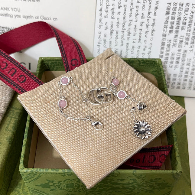 GUCCI 26S DOUBLE G LOGO PINK STONE MULTI CHARM BRACELET IN SILVER TONE METAL
