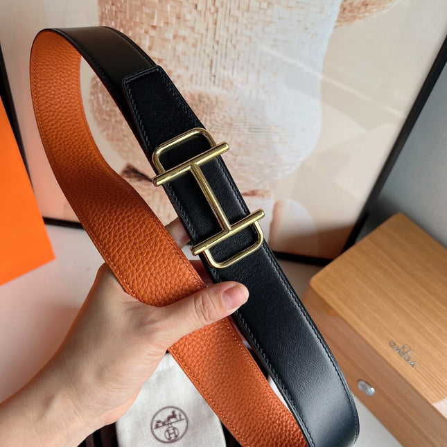 HM ROYAL BELT BUCKLE & REVERSIBLE NOIR AND ORANGE LEATHER STRAP 32 MM GOLD HARDWARE