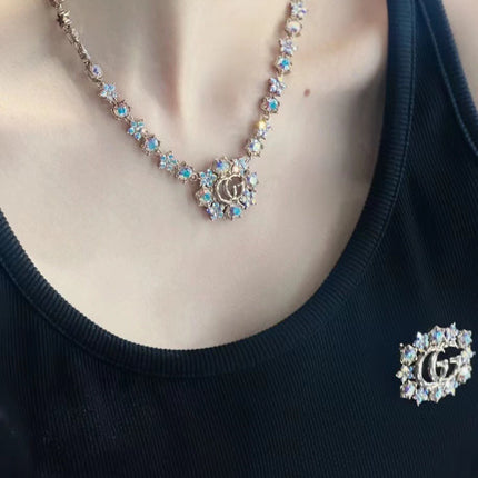 GUCCI 26S INTERLOCKING GG CRYSTAL FLORAL LINK NECKLACE IN ANTIQUE GOLD TONE METAL 620394