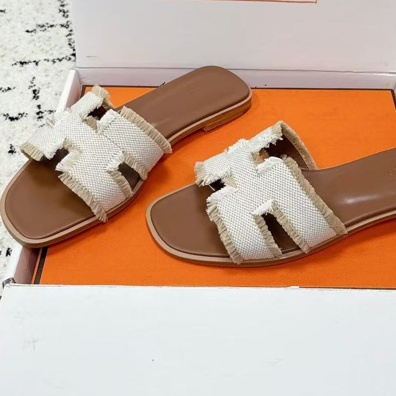 26S ORAN FRINGED SLIDE SANDALS IN ECRU CANVAS