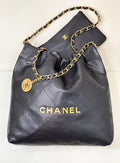CHANEL 26S DRAWSTRING SHOULDER BAG 22 IN BLACK CAVIAR CALFSKIN