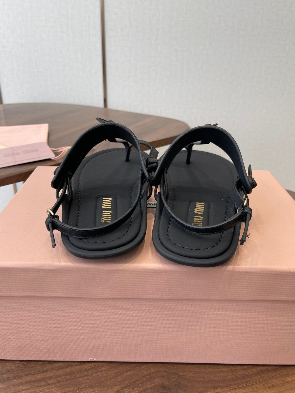 MIUMIU 26S FLIP FLOPS IN BLACK CALFSKIN