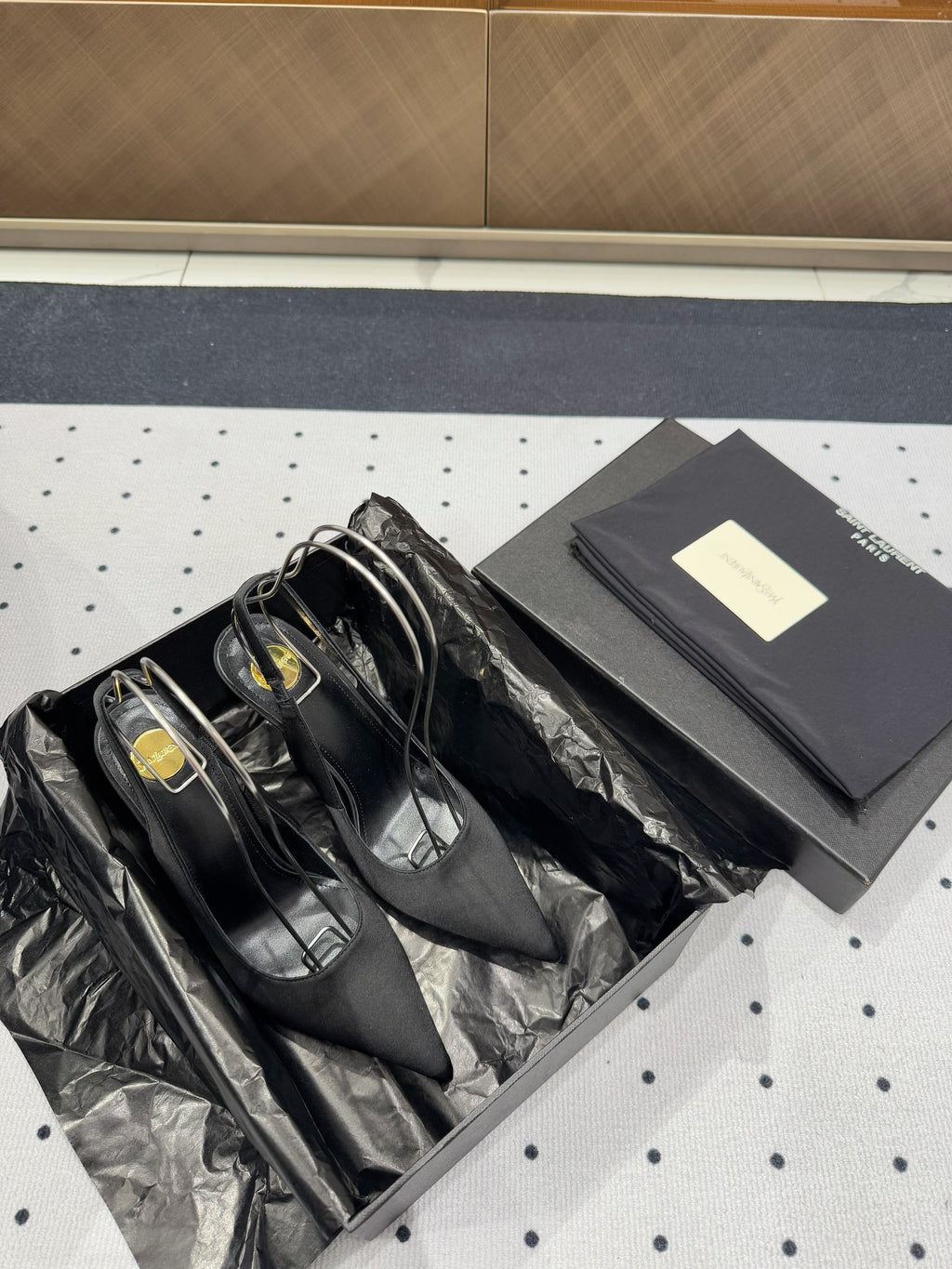 L'ENTRACTE SLINGBACK PUMPS IN BLACK SATIN