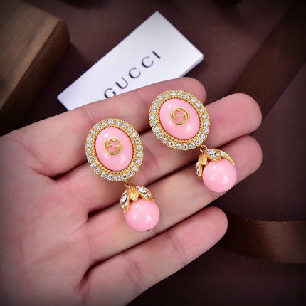 GUCCI 26S GG PINK ENAMEL HALO CRYSTAL DROP EARRINGS IN GOLD TONE METAL 624259