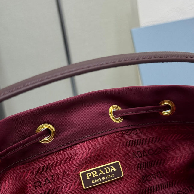 PRADA 25S DUET BUCKET BAG 23 IN BURGUNDY RE-NYLON GOLD HARDWARE