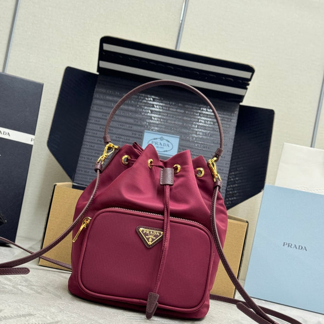 PRADA 25S DUET BUCKET BAG 23 IN BURGUNDY RE-NYLON GOLD HARDWARE
