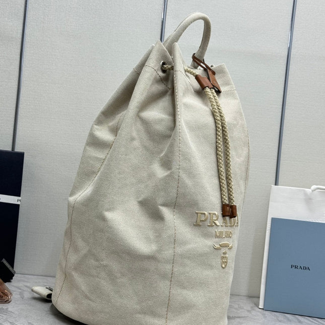 PRADA 25S DRAWSTRING BACKPACK 55 IN BEIGE CANVAS LINEN SILVER HARDWARE