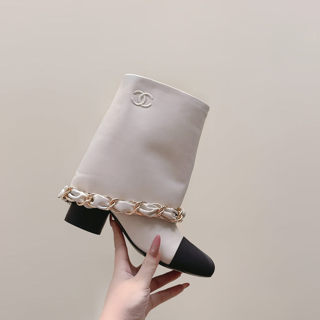 CHANEL 25S CALF-LENGTH BOOTS 45MM IN WHITE AND BLACK CALFSKIN GOLD HARDWARE