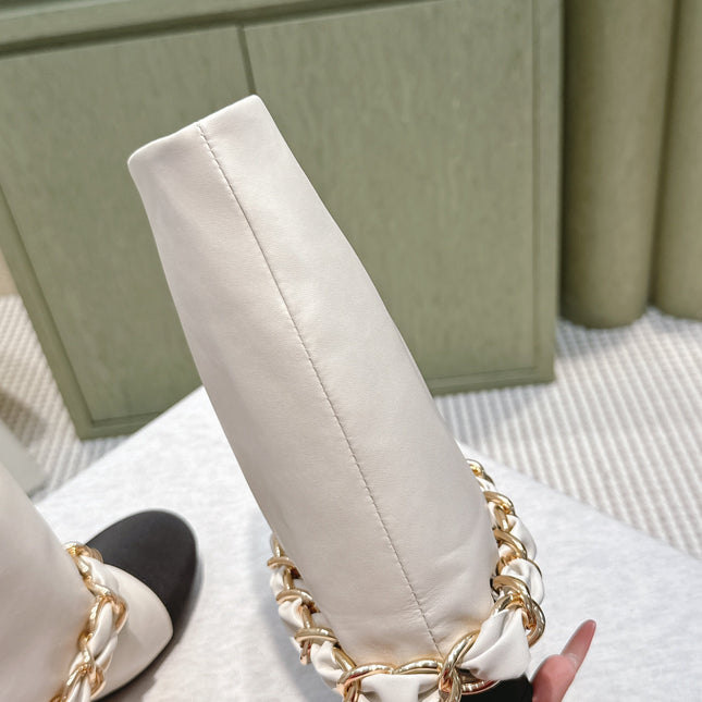 CHANEL 25S CALF-LENGTH BOOTS 45MM IN WHITE AND BLACK CALFSKIN GOLD HARDWARE