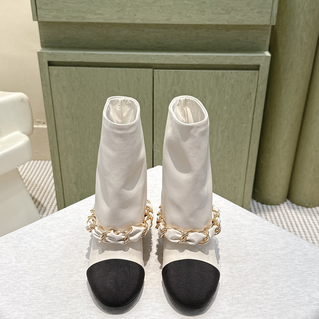 CHANEL 25S CALF-LENGTH BOOTS 45MM IN WHITE AND BLACK CALFSKIN GOLD HARDWARE