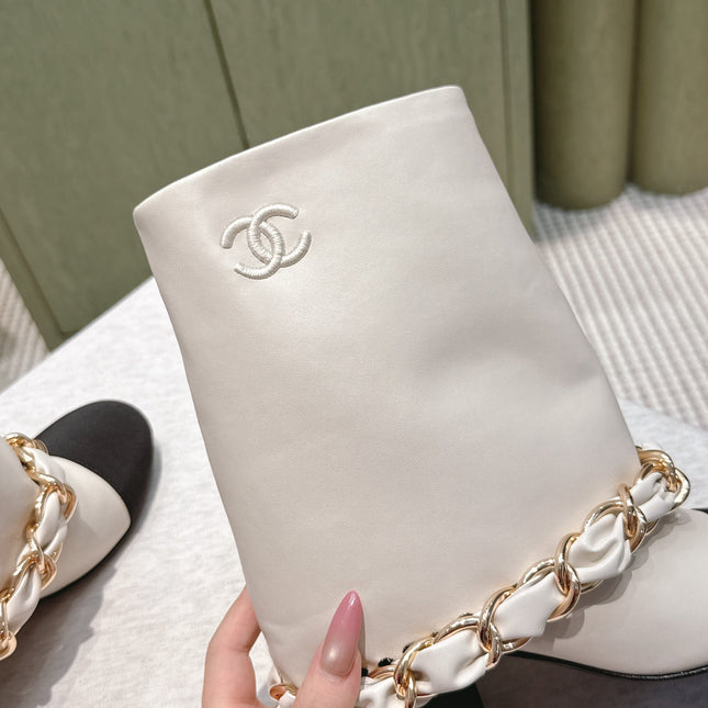 CHANEL 25S CALF-LENGTH BOOTS 45MM IN WHITE AND BLACK CALFSKIN GOLD HARDWARE