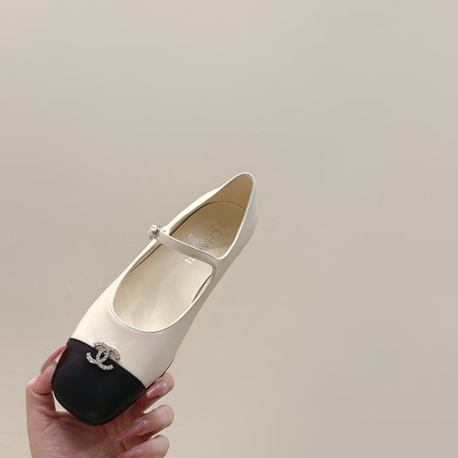 CHANEL 25S MARY JANE FLATS IN IVORY LAMBSKIN WITH BLACK CAP TOE SILVER HARDWARE