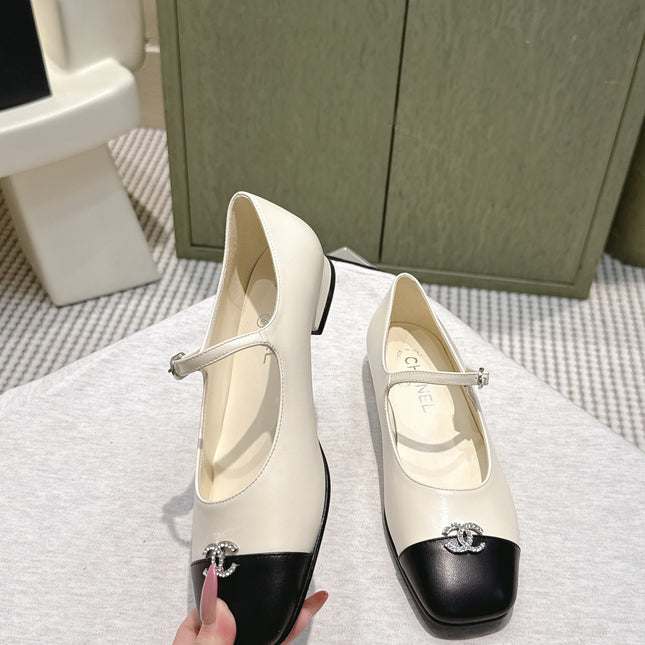 CHANEL 25S MARY JANE FLATS IN IVORY LAMBSKIN WITH BLACK CAP TOE SILVER HARDWARE