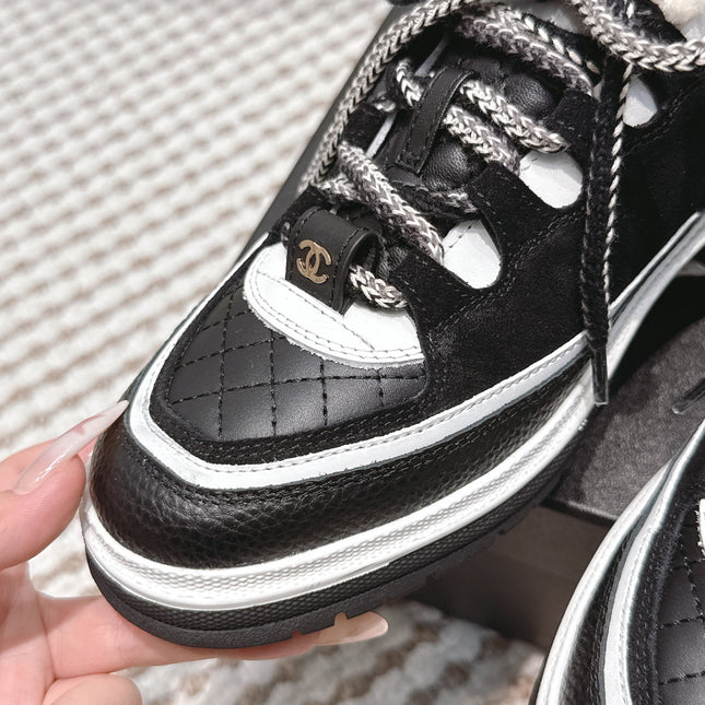 CHANEL 25S THICK-SOLE SNEAKERS IN BLACK AND WHITE CALFSKIN WITH FUR LINING
