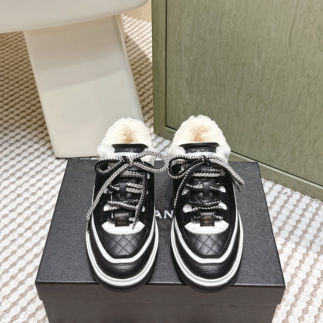 CHANEL 25S THICK-SOLE SNEAKERS IN BLACK AND WHITE CALFSKIN WITH FUR LINING