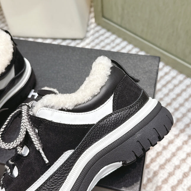 CHANEL 25S THICK-SOLE SNEAKERS IN BLACK AND WHITE CALFSKIN WITH FUR LINING