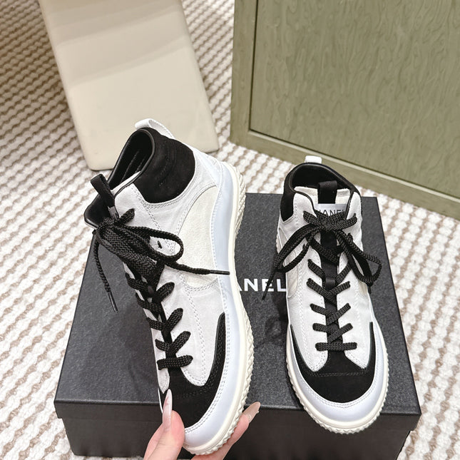 CHANEL 25S HIGH-TOP SNEAKERS IN BLACK AND WHITE CALFSKIN AND SUEDE