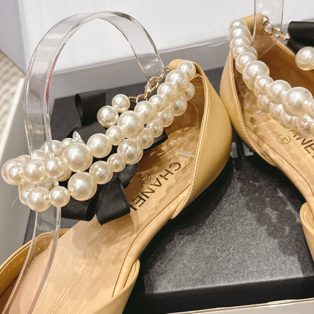 CHANEL 25S ESPADRILLE FLATS IN BEIGE AND BLACK CALFSKIN WITH PEARL STRAP