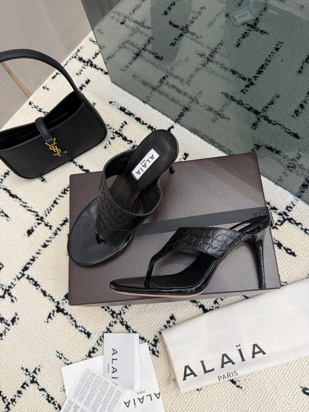ALAIA 26S HEELED THONG MULE SANDALS IN BLACK CALFSKIN