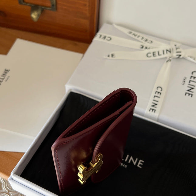 TRIOMPHE WALLET 10 IN BURGUNDY RED CALFSKIN GOLD HARDWARE