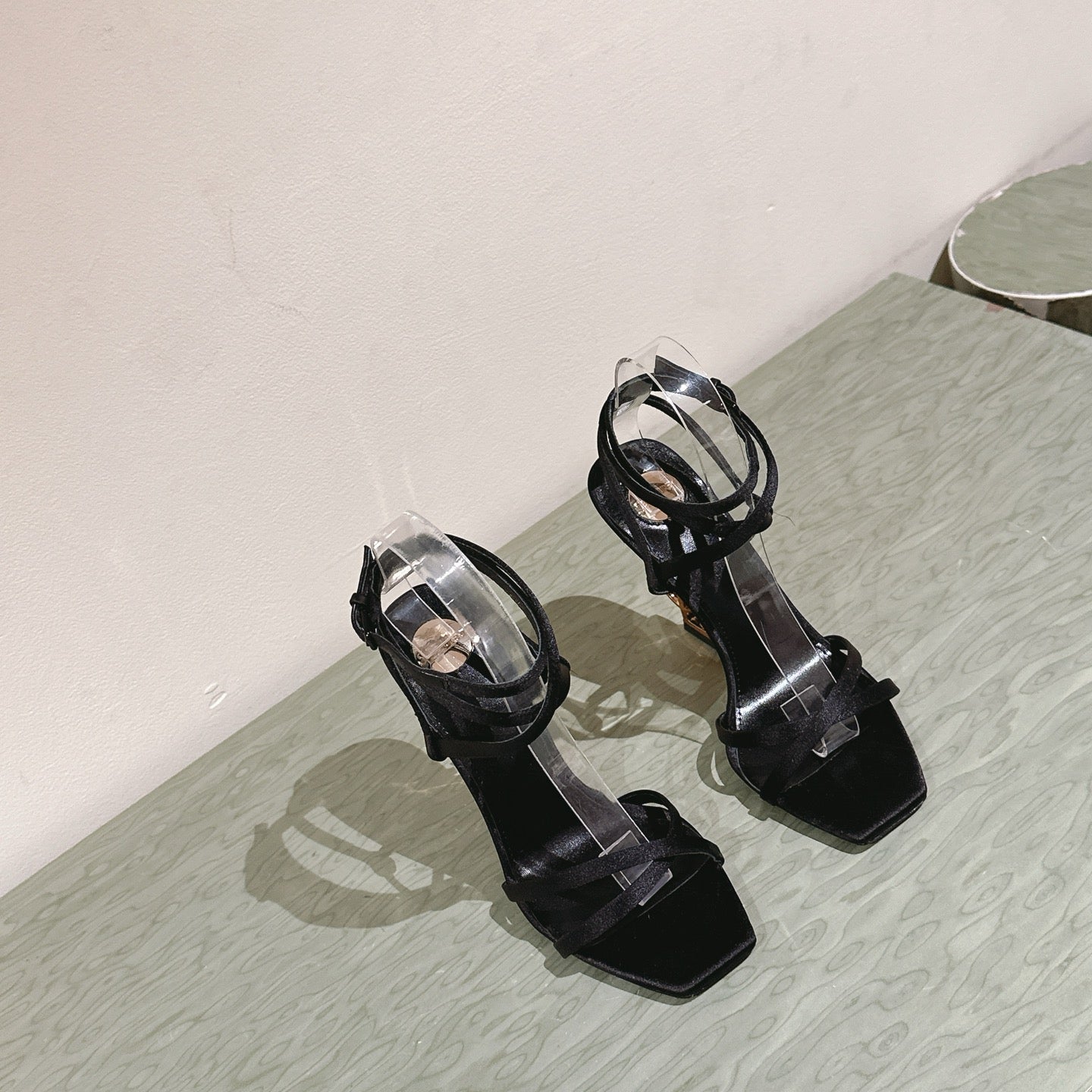 YSL 25S HIGH-HEEL SANDALS 100 MM IN BLACK SATIN WITH YSL LOGO HEEL DESIGN IN GOLD