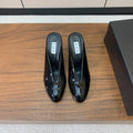 ALAIA 26S WEDGE MULES 70 MM IN BLACK GLOSSY CALFSKIN