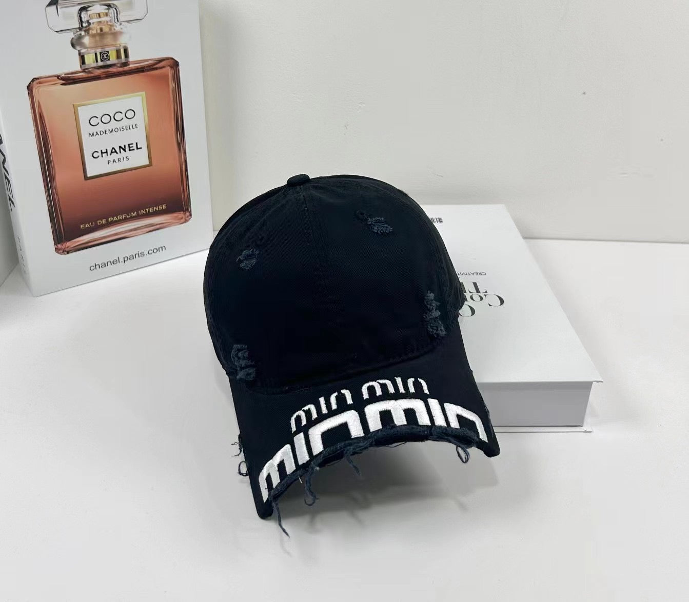 MIUMIU DISTRESSED EMBROIDERED BASEBALL CAP DENIM