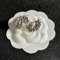 DOUBLE C STUD EARRINGS IN HALF-FLOWER SHAPE WITH PEARL CENTER