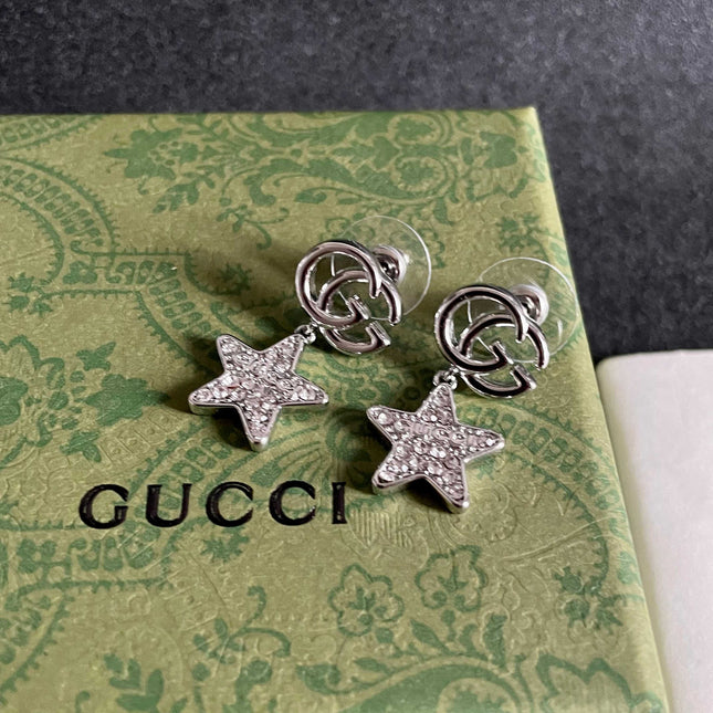 GUCCI 26S DOUBLE G STAR CRYSTAL DROP EARRINGS IN SILVER TONE METAL 627016