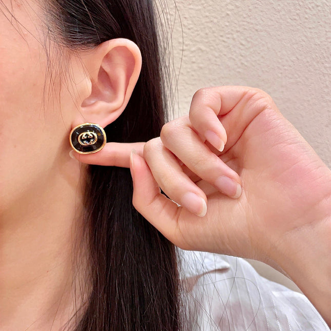 GUCCI 26S INTERLOCKING G ROUND LOGO STUD EARRINGS IN BLACK ENAMEL & GOLD TONE METAL 625716