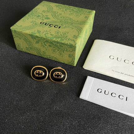 GUCCI 26S INTERLOCKING G ROUND LOGO STUD EARRINGS IN BLACK ENAMEL & GOLD TONE METAL 625716