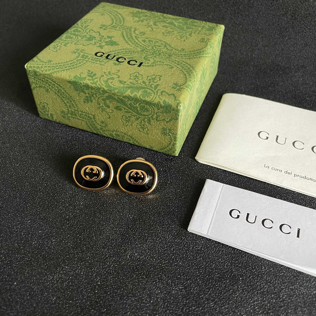 GUCCI 26S INTERLOCKING G ROUND LOGO STUD EARRINGS IN BLACK ENAMEL & GOLD TONE METAL 625716
