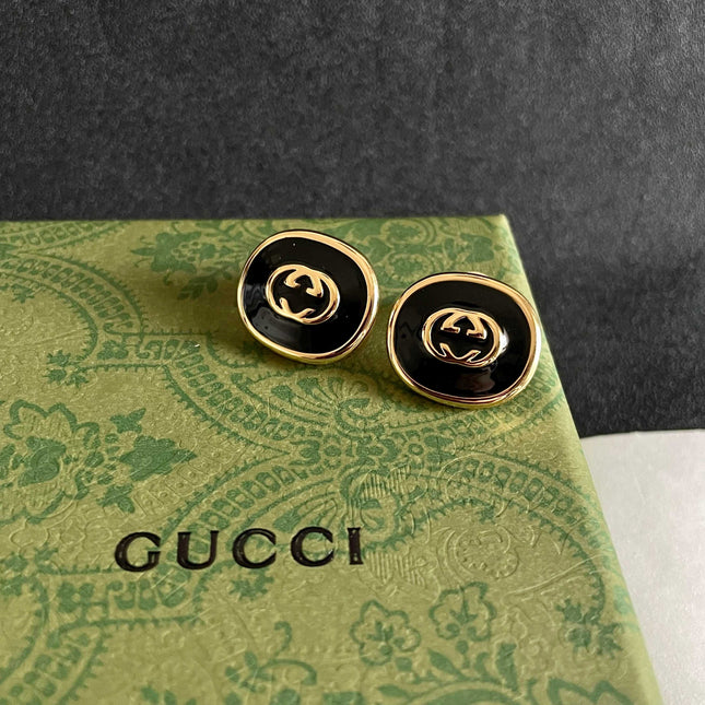 GUCCI 26S INTERLOCKING G ROUND LOGO STUD EARRINGS IN BLACK ENAMEL & GOLD TONE METAL 625716