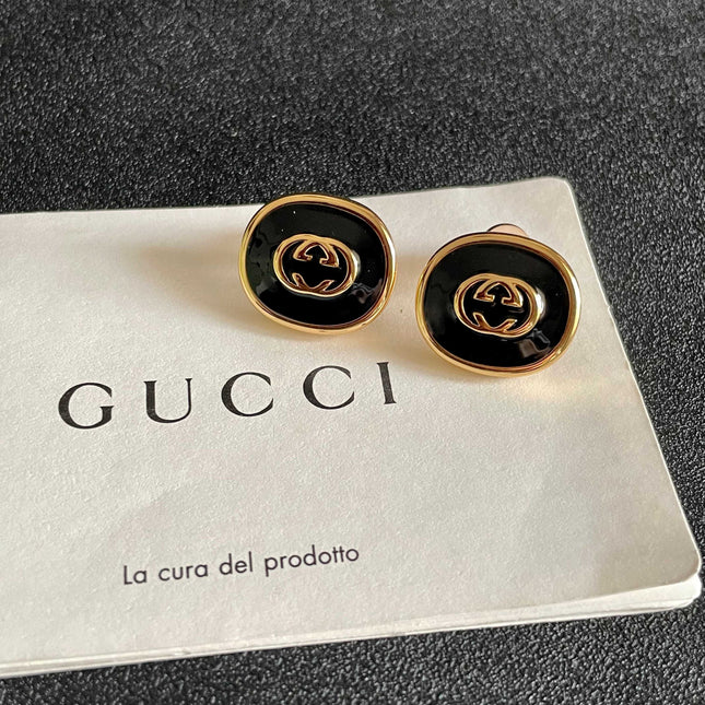 GUCCI 26S INTERLOCKING G ROUND LOGO STUD EARRINGS IN BLACK ENAMEL & GOLD TONE METAL 625716