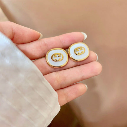 GUCCI 26S INTERLOCKING G ROUND LOGO STUD EARRINGS IN WHITE ENAMEL & GOLD TONE METAL 625717