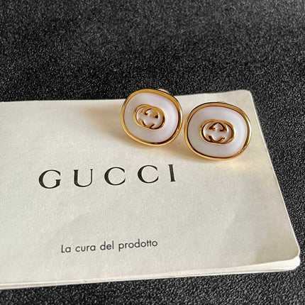 GUCCI 26S INTERLOCKING G ROUND LOGO STUD EARRINGS IN WHITE ENAMEL & GOLD TONE METAL 625717