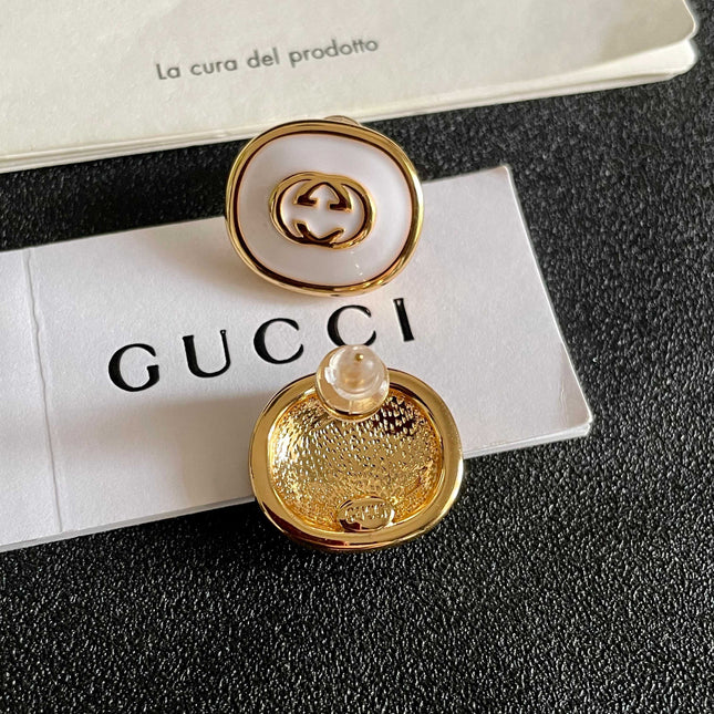 GUCCI 26S INTERLOCKING G ROUND LOGO STUD EARRINGS IN WHITE ENAMEL & GOLD TONE METAL 625717