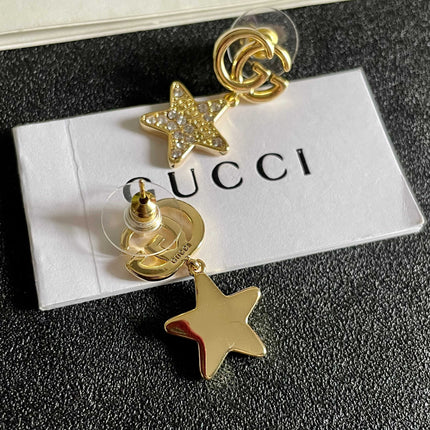 GUCCI 26S DOUBLE G STAR CRYSTAL DROP EARRINGS IN GOLD TONE METAL 627015