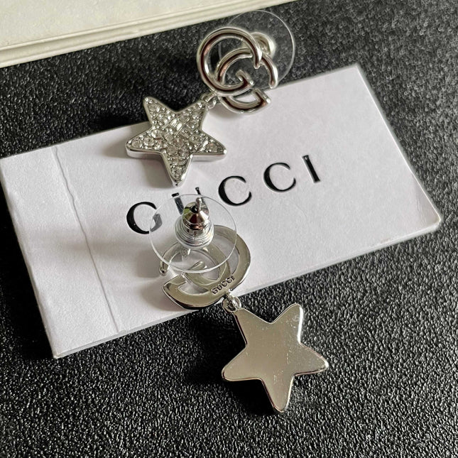 GUCCI 26S DOUBLE G STAR CRYSTAL DROP EARRINGS IN SILVER TONE METAL 627016