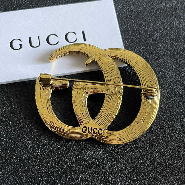 GUCCI 26S DOUBLE G LOGO TEXTURED STATEMENT BROOCH IN AGED GOLD TONE METAL 629062