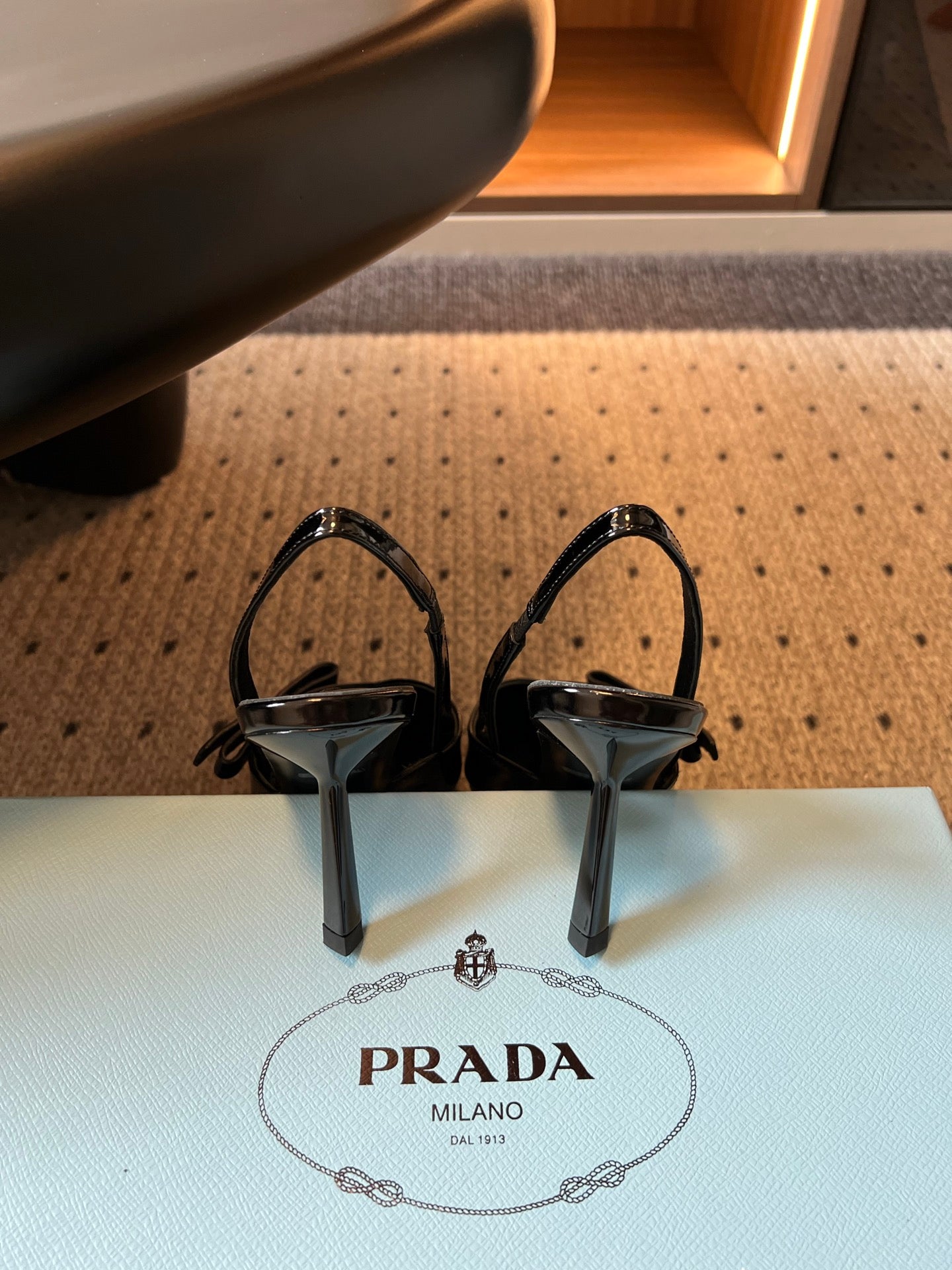 PRADA 26S BOW DETAIL SLINGBACK PUMPS 75MM IN BLACK PATENT CALFSKIN