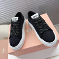MIUMIU 26S PLATFORM SNEAKERS IN BLACK CANVAS