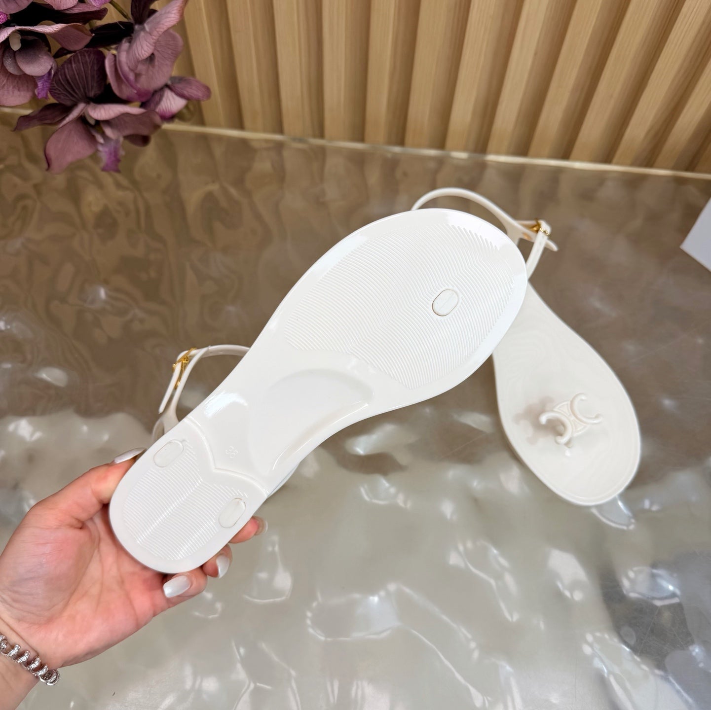 CELINE 26S TRIOMPHE JELLY THONG SANDALS IN WHITE TPU GOLD HARDWARE