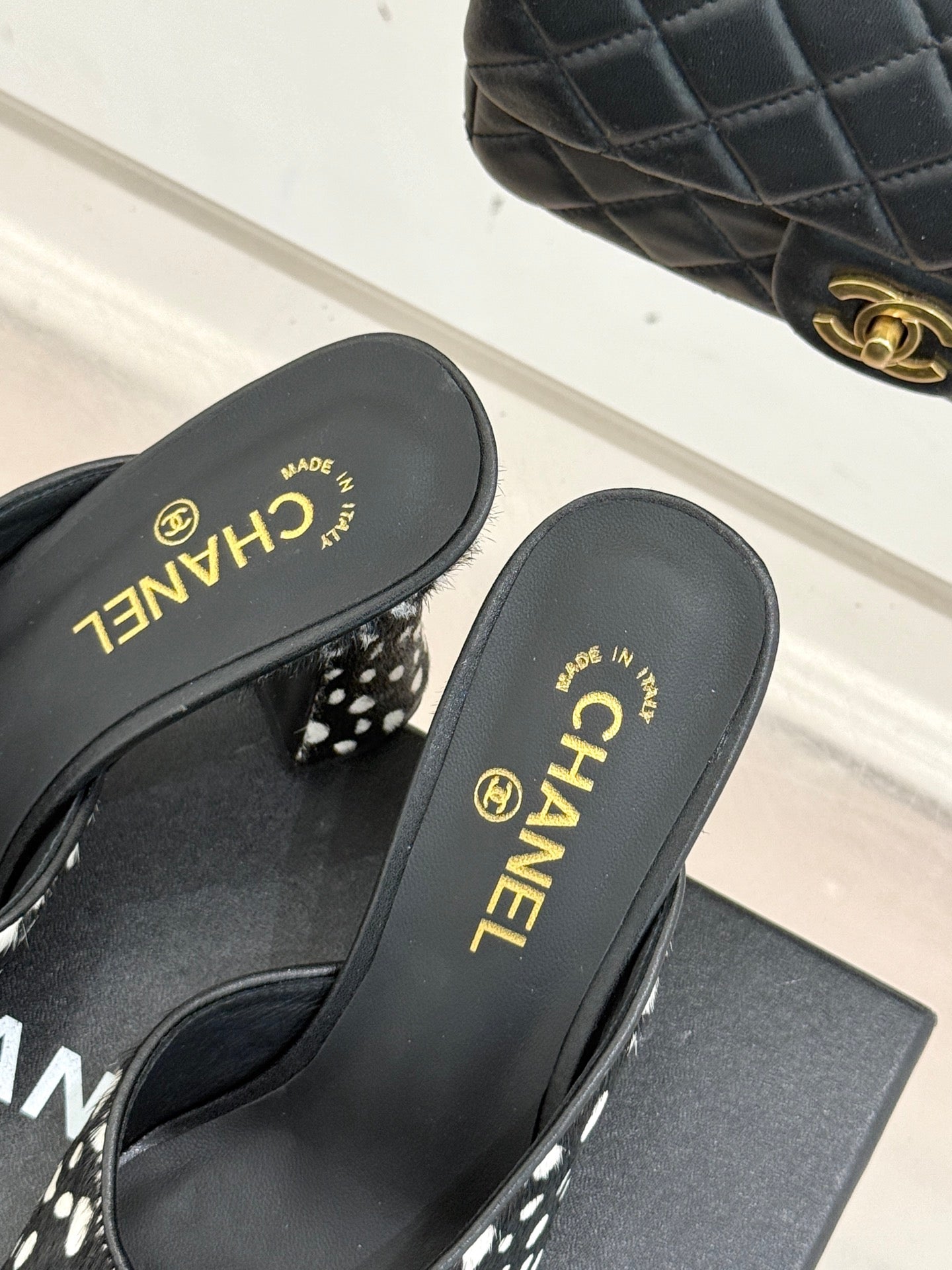 CHANEL POLKA DOT PATTERN MULES IN BLACK MIX GREEN FUR