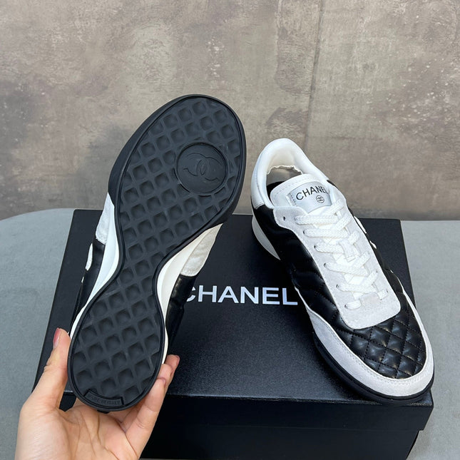 CHANEL 26S SNEAKERS IN BLACK AND WHITE QUILTED CALFSKIN CC LOGO