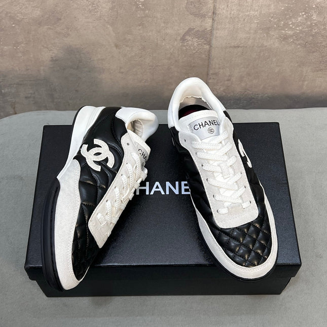 CHANEL 26S SNEAKERS IN BLACK AND WHITE QUILTED CALFSKIN CC LOGO